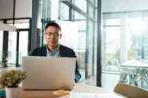 Mature businessman working on a laptop in an office